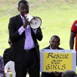 Protester addresses a sit-in rally in support of the release of the abducted Chibok schoolgirls, at the Unity Fountain in Abuja