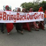Nigerians take part in a protest demanding for the release of secondary school girls abducted from the remote village of Chibok, in Asokoro, Abuja
