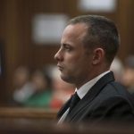 Olympic and Paralympic track star Oscar Pistorius sits in the dock in the North Gauteng High Court in Pretoria