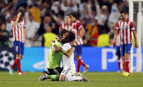 Real Madrid's Marcelo, center right, and goalkeeper Iker Casillas