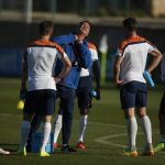 The Netherlands national soccer team coach van Gaal (C) gestures as he talks with his players during a training session in Lagos