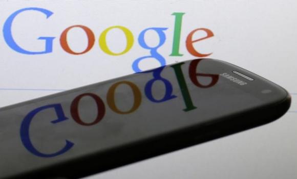 Photo illustration of Google logo is reflected on the screen of a Samsung Galaxy S4 smartphone
