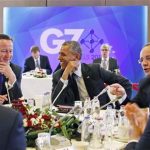 Barack Obama, center, laughs as he looks at British Prime Minister David Cameron, left, with French President Francois Hollande