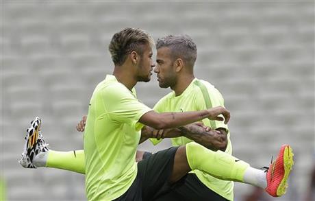 Brazil's Neymar, left front, and teammate Dani Alves