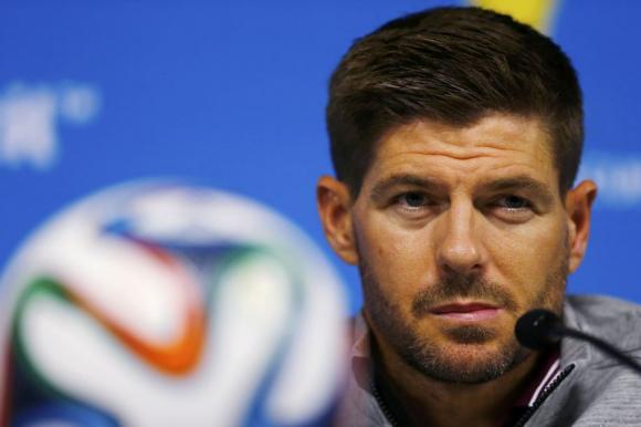 England's Steven Gerrard attends a news conference after a training session at the Corinthians arena at Sao Paulo city