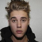 Handout shows Canadian pop singer Justin Bieber in police custody in Miami Beach, Florida