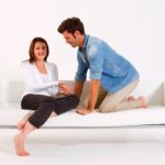 Loving Couple Sitting In Sofa