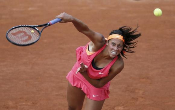 Keys of the U.S. serves the ball to Errani of Italy during their women's singles match at the French Open tennis tournament at the Roland Garros stadium in Paris