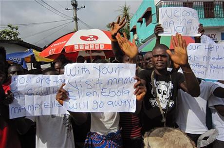 People protest outside a hospital as Liberia President Ellen Johnson Sirleaf