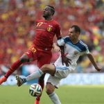 Russia's Sergei Ignashevich, right, challenges Belgium's Divock Origi