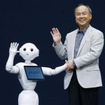 Softbank Corp. President Masayoshi Son, right, and Pepper