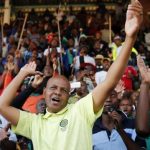 President of South Africa's Association of Mine workers and Construction Union Joseph Mathunjwa sings before addressing the Lonmin strikers at the Wonderkop stadium in Nkaneng township outside the Lonmin mine in Rustenburg