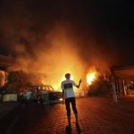 The U.S. Consulate in Benghazi is seen in flames during a protest
