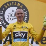 Team Sky rider and Tour de France winner Christopher Froome of Britain holds a trophy and a stuffed toy on a podium during a victory ceremony in Saitma