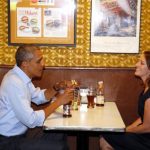 U.S. President Barack Obama visits with Rebekah Erler at Matt's Bar in Minneapolis