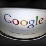 A Google search page is reflected in sunglasses in this photo illustration taken in Brussels