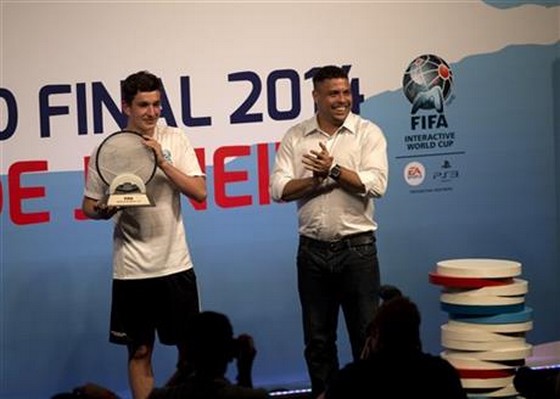 Denmark’s August Rosenmeier, left, winner of the FIFA Interactive World Cup 2014