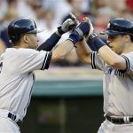 Derek Jeter, left, congratulates Mark Teixeira