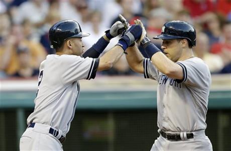 Derek Jeter, left, congratulates Mark Teixeira