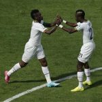 Ghana's Asamoah Gyan, left, celebrates with Ghana's John Boye, right