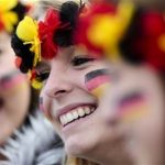 Three women arrive at the airport Tegel to welcome German national soccer team