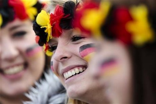 Three women arrive at the airport Tegel to welcome German national soccer team
