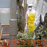 Ebola isolation unit wearing protective gear