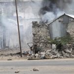 Somali government soldiers hold their position against suspected militants during an attack at the Jilacow underground cell inside a national security compound in Mogadishu