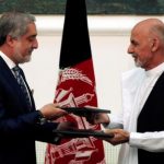 Afghan rival presidential candidates Abdullah Abdullah and Ashraf Ghani exchange signed agreements for the country's unity government in Kabul