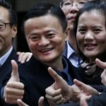 Alibaba Group Holding Ltd founder Jack Ma poses as he arrives at the New York Stock Exchange for his company's initial public offering in New York
