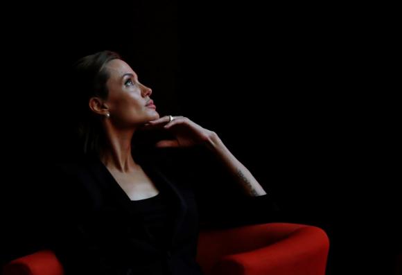 Actress and campaigner Angelina Jolie attends a summit to end sexual violence in conflict, at the Excel centre in London