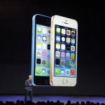 Apple CEO Tim Cook speaks on stage during event at the Flint Center in Cupertino