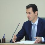 Syria's President Bashar al-Assad heads a meeting of his new cabinet in Damascus