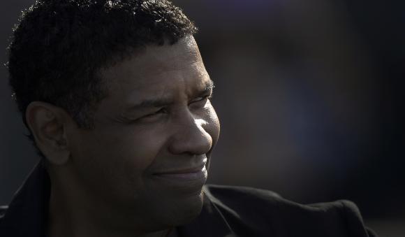 U.S. actor and cast member Denzel Washington arrives for a photocall to promote his feature film "The Equalizer", on the first day of the 62nd San Sebastian Film Festival, in San Sebastian