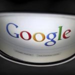 A Google search page is reflected in sunglasses in this photo illustration taken in Brussels