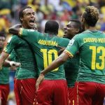 Cameroon's Matip celebrates his goal against Brazil with his teammates during their 2014 World Cup Group A soccer match at the Brasilia national stadium in Brasilia