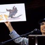 Mabuchi accepts the Physics Prize for his study "Frictional Coefficient under Banana Skin" at the 24th First Annual Ig Nobel Prizes awards ceremony at Harvard University in Cambridge