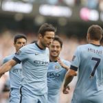 Manchester City's players run towards Frank Lampard after he scored a goal against Chelsea during their English Premier League soccer match at the Etihad stadium in Manchester