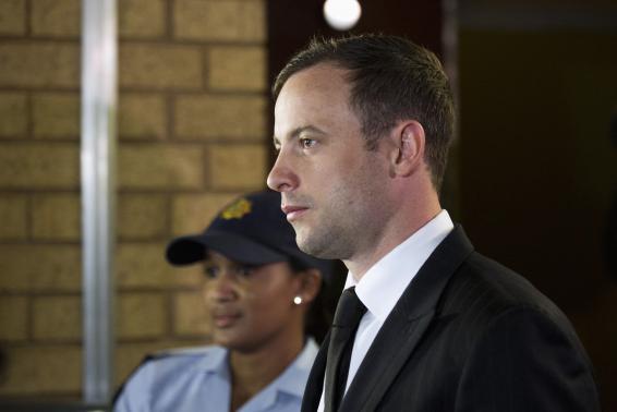 South African Olympic and Paralympic track star Oscar Pistorius arrives at the North Gauteng High Court in Pretoria