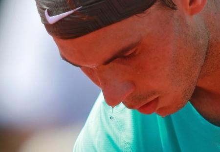 Rafael Nadal of Spain prepares to serve to Novak Djokovic of Serbia during their men's singles final match at the French Open Tennis tournament at the Roland Garros stadium in Paris