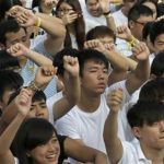 Students wave their fists during a rally at the Chinese University of Hong Kong campus