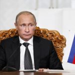 Russian President Vladimir Putin attends a signing ceremony with his Mongolian counterpart Tsakhia Elbegdorj at the national parliament building in Ulan Bator