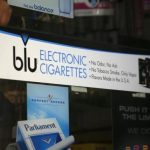 Advertisement for the e-cigarette brand blu is seen on window of a store in New York