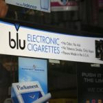 Advertisement for the e-cigarette brand blu is seen on window of a store in New York