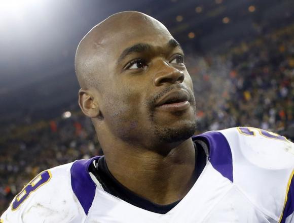 Minnesota Vikings Adrian Peterson leaves the field after a season-ending loss to the Green Bay Packers in Green Bay