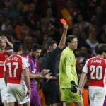 Arsenal goalkeeper Szczesny is shown a red card by match referee Rocchi during their Champions League soccer match against Galatasaray at the Emirates Stadium in London