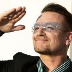 Bono reacts after being awarded Commander in the Order of Arts and Letters during a ceremony in Paris