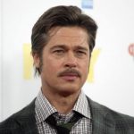 Actor Brad Pitt poses during a photocall for his film "Fury" in London
