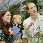 Britain's Catherine, Duchess of Cambridge, carries her son Prince George alongside her husband Prince William as they visit the Sensational Butterflies exhibition at the Natural History Museum in London