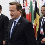 British Prime Minister Cameron arrives for the Asia-Europe Meeting at the congress center in Milan
